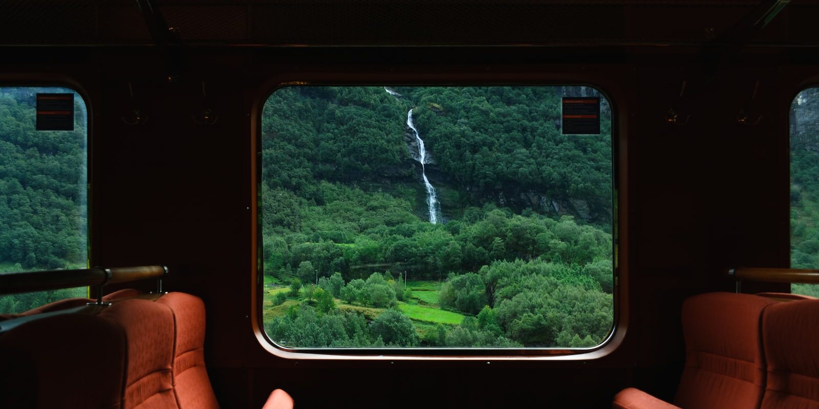 person holding black smartphone with brown leather case